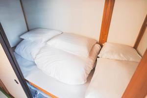 เตียงในห้องที่ New! Kamata close Haneda AP - Traditional & Hot Spring