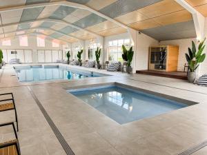 a large swimming pool in a large room with at BIG4 Tasman Holiday Parks - Warrnambool in Warrnambool