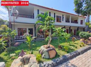 Κήπος έξω από το Mango Guesthouse