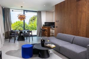 a living room with a couch and a table at MareLux in Dubrovnik