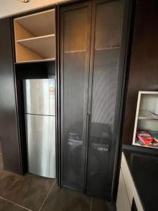 A kitchen or kitchenette at Borderless Swimming Pool - Invincible Twin Towers View - Free WiFi