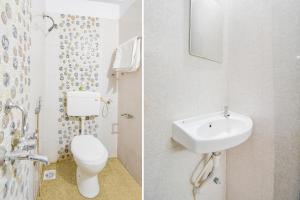 biała łazienka z umywalką i toaletą w obiekcie FabHotel Happy Stay In w mieście Hinjewadi
