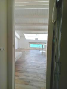 A bed or beds in a room at Dolce Dimora Charme Mare
