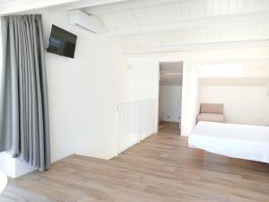 A bed or beds in a room at Dolce Dimora Charme Mare