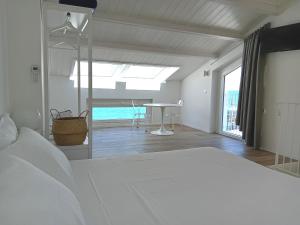 A bed or beds in a room at Dolce Dimora Charme Mare