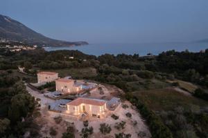 an aerial view of a large house in a field at Brand New: Kefalonia Stone Villas - Villa Trapezaki Retreat in Trapezaki