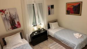 Ένα ή περισσότερα κρεβάτια σε δωμάτιο στο Patras Centre Apartment