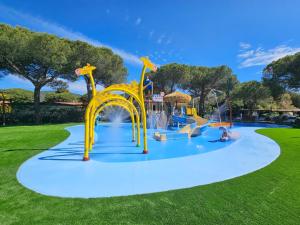 a water park with a water slide at Camping Lacona Pineta in Capoliveri