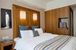 Postel nebo postele na pokoji v ubytování Hermes Hotel