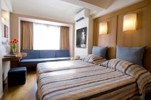Postel nebo postele na pokoji v ubytování Hermes Hotel