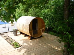 a wooden pod sitting on top of a wooden deck at Atelier chambres in Semur-en-Auxois