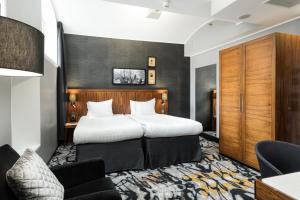 Postel nebo postele na pokoji v ubytování Home Hotel Katajanokka