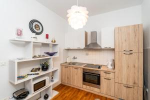 Kuchyň nebo kuchyňský kout v ubytování Apartmani Kadena