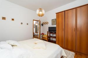 Postel nebo postele na pokoji v ubytování Apartmani Kadena