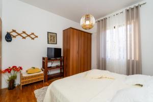 Postel nebo postele na pokoji v ubytování Apartmani Kadena