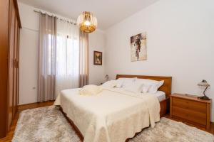 Postel nebo postele na pokoji v ubytování Apartmani Kadena