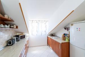 Kuchyň nebo kuchyňský kout v ubytování Apartmani Kadena