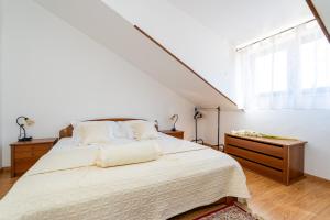 Postel nebo postele na pokoji v ubytování Apartmani Kadena
