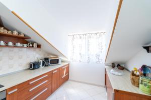 Kuchyň nebo kuchyňský kout v ubytování Apartmani Kadena