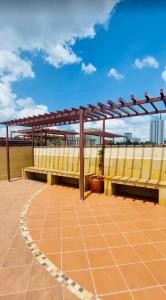 a bench sitting on top of a building at Cozy Retreat Near Nairobi National Park, Giraffe Centre & Wilson Airport in Nairobi