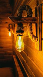 a light hanging on a wall with a rope at Sheriff, Olympos in Kumluca