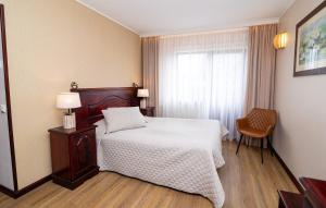 Katil atau katil-katil dalam bilik di Hotel Legend