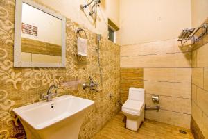 a bathroom with a sink and a toilet at FabHotel G-5 Villa in Ludhiana