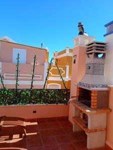a lighthouse on the side of a building at Casa Calypso San Juan de los Terreros in San Juan de los Terreros