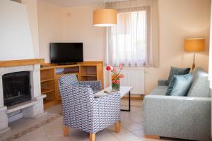 TV a/nebo společenská místnost v ubytování Szalajka Liget Hotel és Apartmanházak