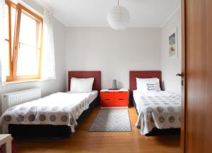 Posteľ alebo postele v izbe v ubytovaní Ski & Bike Apartment - Apartamenty Pod Śnieżką