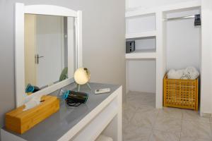 A television and/or entertainment centre at Albouro Seafront Apartments