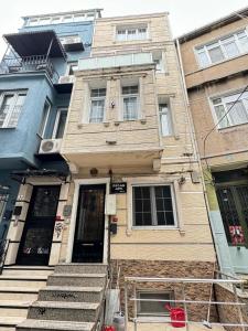 an old house with stairs in front of it at Plaesant apartment with Balcony in Istanbul