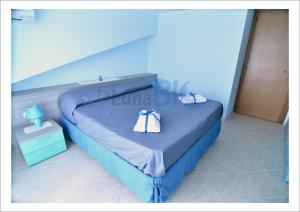 Säng eller sängar i ett rum på La Luna Blu