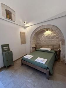 Un pat sau paturi într-o cameră la iCONICO - Authentic Trulli Experience