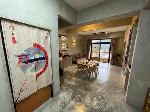 a kitchen and a dining room with a table at Genting View Resort Duplex Penthouse 5R4B 17pax by Jen.dehome in Genting Highlands +47 photos