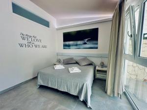 Кровать или кровати в номере 309 Le Saline - Stintino