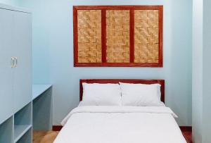 a bedroom with a bed and a window at McKinley Grand Marina Hotel and Resort in Isabela +9 photos