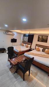 Ένα ή περισσότερα κρεβάτια σε δωμάτιο στο Airport hotel ROYAL RESIDENCY