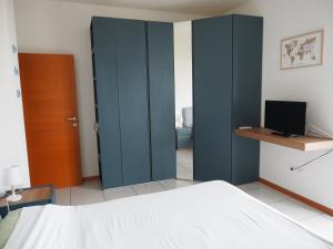 En eller flere senge i et værelse på Casa Cali Civitanova