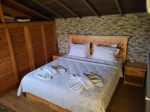 a bedroom with a bed with towels on it at Bahaus Resort in Dalyan