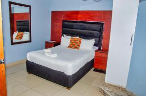 Postel nebo postele na pokoji v ubytování Riverstone Guest Lodge