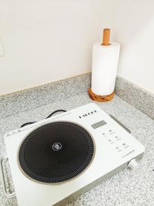 a radio on a counter with a roll of toilet paper at The Hive tower D with pool, Wifi, and balcony in Taytay