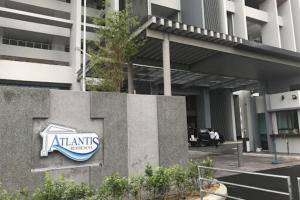 a sign for an atantis hotel in front of a building at Atlantis Residences Melaka in Melaka