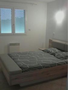 Postel nebo postele na pokoji v ubytování Appartement F3(70m²) vue sur la mer + 17 fotografií