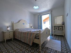 A bed or beds in a room at Dommu de Nannai Moro: Appartamento con terrazza