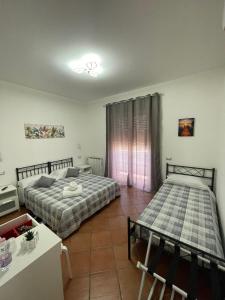 Postel nebo postele na pokoji v ubytování Royal House Fiumicino