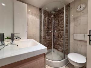 a bathroom with a shower and a sink and a toilet at Casa Via Bodman-Ludwigshafen in Bodman-Ludwigshafen +28 photos