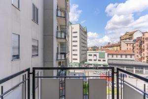 a balcony with a view of a city at SIL5 - Apartment Bright - Luxury in Milan