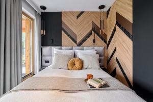 מיטה או מיטות בחדר ב-Białka SPA & Resort