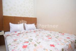 Letto o letti in una camera di Tatti Inn Syariah Seturan RedPartner